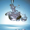 Panoramic Images Iridescent water bubble formation floating above the surface of deep blue water Poster Print by Panoramic Images - 24 x 20